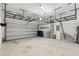 Spacious garage with overhead storage racks and ample room for parking and storage at 1003 Starboard Ct, Oldsmar, FL 34677