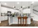 Bright kitchen featuring white cabinets, granite countertops, pendant lighting, and stainless steel appliances at 1003 Starboard Ct, Oldsmar, FL 34677