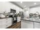 Well-appointed kitchen with granite countertops, stainless steel appliances, and modern finishes at 1003 Starboard Ct, Oldsmar, FL 34677