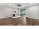 Bright living room featuring hardwood floors, ceiling fan, and sliding doors to a private balcony at 1003 Starboard Ct, Oldsmar, FL 34677