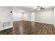 Spacious living room with hardwood floors, recessed lighting, and ample natural light at 1003 Starboard Ct, Oldsmar, FL 34677