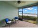 Relaxing screened patio with waterfront views, perfect for enjoying serene outdoor moments at 1003 Starboard Ct, Oldsmar, FL 34677
