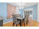 Formal dining room with hardwood floors and a view into the kitchen at 1023 W Ohio Ave, Tampa, FL 33603