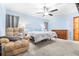 Spacious bedroom with light blue walls and ceiling fan at 103 Barkfield St, Brandon, FL 33511