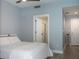 Cozy bedroom featuring a comfortable bed and a doorway to the bathroom at 1120 E Kennedy Blvd # 1225, Tampa, FL 33602