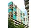 Modern apartment building featuring private balconies and a covered parking garage at 1120 E Kennedy Blvd # 1225, Tampa, FL 33602