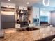 Gourmet kitchen with stainless steel appliances, granite countertops, and modern cabinets at 1120 E Kennedy Blvd # 1225, Tampa, FL 33602