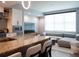 Open-concept living room featuring a granite kitchen island and modern sectional at 1120 E Kennedy Blvd # 1225, Tampa, FL 33602