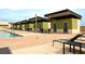 Inviting community pool featuring several lounge chairs and private poolside cabanas at 1120 E Kennedy Blvd # 1225, Tampa, FL 33602