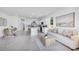 Open concept kitchen and living area with island and dining space at 11851 Davis Dr, Largo, FL 33774