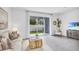 Living room featuring comfortable seating and a large TV at 11851 Davis Dr, Largo, FL 33774