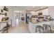 Modern kitchen with stainless steel appliances and granite island at 12019 Lansing Gln, Parrish, FL 34219