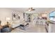 Spacious living room with open floor plan and large TV at 12019 Lansing Gln, Parrish, FL 34219