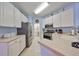 Bright kitchen featuring stainless steel appliances and white cabinets at 1237 Huntington Greens Dr, Sun City Center, FL 33573