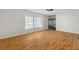 Bright living room featuring hardwood floors and a large window at 13208 Lake Magdalene Blvd, Tampa, FL 33618