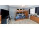 bedroom with bunk beds, dresser, and TV at 1351 Fairfield Dr, Clearwater, FL 33764