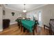 Bright dining room with a large table, green tablecloth, and access to the pool at 1351 Fairfield Dr, Clearwater, FL 33764