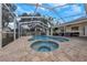 Screened-in pool and spa with patio at 1351 Fairfield Dr, Clearwater, FL 33764