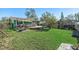 Spacious backyard with deck and green grass at 1723 Indiana St, Dunedin, FL 34698