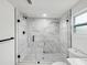 Large walk-in shower with marble tile and glass enclosure at 1741 25Th N Ave, St Petersburg, FL 33713