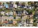 Overhead aerial shot of a residential community with swimming pools, tree lined streets, and houses at 1809 Chinaberry Dr, Oldsmar, FL 34677