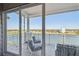 Relax on this condo balcony, enjoying the peaceful views of the bay and nearby neighborhoods at 20001 Gulf Blvd # 501, Indian Shores, FL 33785