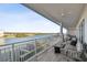 Enjoy this spacious covered balcony with ample seating and scenic water views at 20001 Gulf Blvd # 501, Indian Shores, FL 33785