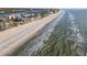 Aerial view of a pristine white sand beach with clear blue water along a coastline at 20001 Gulf Blvd # 501, Indian Shores, FL 33785