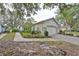 House exterior showcasing a two-car garage and landscaped front yard at 2188 Acadia Greens Dr, Sun City Center, FL 33573