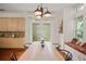 Kitchen dining area with built-in bench seating and wood table at 2223 Rising Creek Court, Dunedin, FL 34698