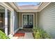 Elegant entryway with double doors and tile flooring at 2223 Rising Creek Court, Dunedin, FL 34698