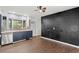 Updated kitchen with dark blue cabinets and a black accent wall at 2374 Conway Blvd, Port Charlotte, FL 33952