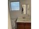 Clean bathroom with a vanity, toilet, and mirror at 2508 50Th N Ave, St Petersburg, FL 33714