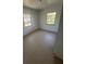 Simple bedroom with two windows and light brown flooring at 2508 50Th N Ave, St Petersburg, FL 33714