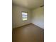 Simple bedroom with window and light brown flooring at 2508 50Th N Ave, St Petersburg, FL 33714