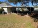 Carport area with storage items and surrounding yard at 2508 50Th N Ave, St Petersburg, FL 33714