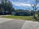 Ranch style home with carport and mature trees at 2508 50Th N Ave, St Petersburg, FL 33714