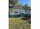Rear view of a charming cottage with green and white exterior at 2508 50Th N Ave, St Petersburg, FL 33714