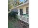 Side of house with white picket fence and screen porch at 2508 50Th N Ave, St Petersburg, FL 33714