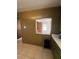 Kitchen with green cabinets and a pass-through window at 2508 50Th N Ave, St Petersburg, FL 33714