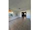 Living room with tiled floors and view into kitchen at 2508 50Th N Ave, St Petersburg, FL 33714