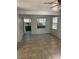Spacious living room with tile floors and access to porch at 2508 50Th N Ave, St Petersburg, FL 33714