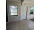 Sunroom with exterior access and tile floors at 2508 50Th N Ave, St Petersburg, FL 33714