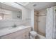 Clean bathroom with shower stall, toilet and vanity with granite countertop at 2559 Forest Run Ct, Clearwater, FL 33761