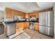 Kitchen with stainless steel appliances and wood cabinets at 2559 Forest Run Ct, Clearwater, FL 33761