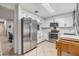 Modern kitchen with stainless steel appliances and white cabinets at 2898 Thaxton Dr # 77, Palm Harbor, FL 34684