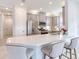 Modern kitchen with white quartz countertops and gray cabinets at 4521 Garofalo Rd, Wesley Chapel, FL 33543