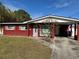 Red brick ranch home with carport and mature landscaping at 4727 W W Wisconsin Ave # Ave, Tampa, FL 33616