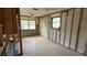 A gutted bedroom ready for renovation, featuring exposed walls and flooring at 5641 1St Ne St, St Petersburg, FL 33703
