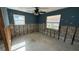 A bedroom in need of renovation, with exposed walls and flooring at 5641 1St Ne St, St Petersburg, FL 33703